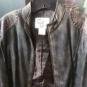 Distressed leather jacket with metal accents